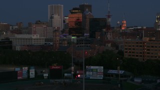 DX0002_210_015 - 5.7K aerial stock footage of orbiting Spiritus Christi Church at twilight, Downtown Rochester, New York