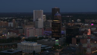 5.7K aerial stock footage orbit the city skyline behind First Federal Plaza at twilight, Downtown Rochester, New York Aerial Stock Footage | DX0002_210_017