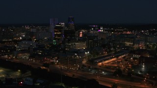 5.7K aerial stock footage of flying away from office buildings and skyline at night, Downtown Rochester, New York Aerial Stock Footage | DX0002_210_030