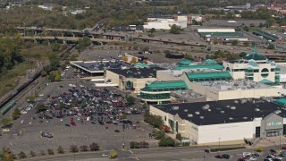 5.7K aerial stock footage of flying toward a shopping mall in Syracuse, New York Aerial Stock Footage | DX0002_211_029