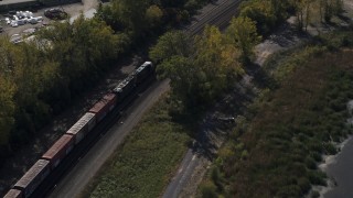 5.7K aerial stock footage of a train on the shore of a lake in Syracuse, New York Aerial Stock Footage | DX0002_211_032