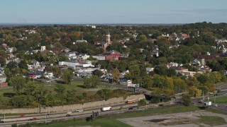 5.7K aerial stock footage fly away from and past the St John the Baptist church steeple in Syracuse, New York Aerial Stock Footage | DX0002_212_013