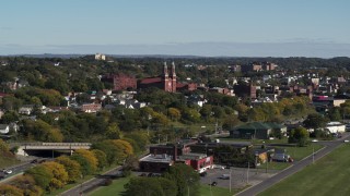 5.7K aerial stock footage of descending past Assumption Church in Syracuse, New York Aerial Stock Footage | DX0002_212_017