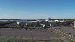 5.7K aerial stock footage of the Destiny USA shopping mall while descending by parking lot, Syracuse, New York Aerial Stock Footage | DX0002_212_022