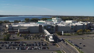 5.7K aerial stock footage flying over parking lots to approach the Destiny USA shopping mall, Syracuse, New York Aerial Stock Footage | DX0002_212_026