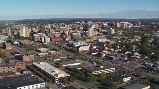 5.7K aerial stock footage of flying by and away from office buildings in the city's downtown area, Downtown Syracuse, New York Aerial Stock Footage | DX0002_212_031