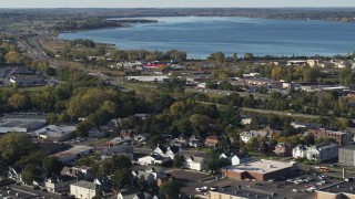 5.7K aerial stock footage of warehouse buildings near Onondaga Lake in Syracuse, New York Aerial Stock Footage | DX0002_213_004