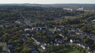 5.7K aerial stock footage of passing by church and a neighborhood in Syracuse, New York Aerial Stock Footage | DX0002_213_005