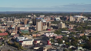 DX0002_213_009 - 5.7K aerial stock footage of slowly flying by office buildings in Downtown Syracuse, New York