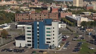 5.7K aerial stock footage of orbiting a modern office building in Syracuse, New York Aerial Stock Footage | DX0002_213_017