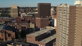 5.7K aerial stock footage of flying by apartment high-rise to reveal Chase Towers, Downtown Syracuse, New York Aerial Stock Footage | DX0002_213_028