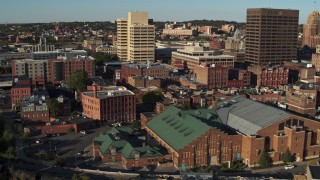 5.7K aerial stock footage orbit Museum of Science & Technology, office buildings in background, Downtown Syracuse, New York Aerial Stock Footage | DX0002_213_035