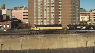 5.7K aerial stock footage track and orbit a train in Downtown Syracuse, New York Aerial Stock Footage | DX0002_214_004