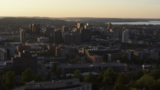 5.7K aerial stock footage of downtown seen from campus buildings at Syracuse University at sunset, New York Aerial Stock Footage | DX0002_214_021