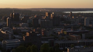 5.7K aerial stock footage of office buildings in Downtown Syracuse at sunset, New York Aerial Stock Footage | DX0002_214_023