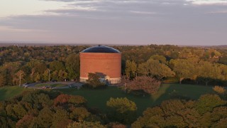 5.7K aerial stock footage of an orbit of the Stewart Stand Pipe at Thornden Park, Syracuse at sunset, New York Aerial Stock Footage | DX0002_214_030