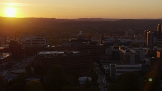 5.7K aerial stock footage of orbiting Crouse Hospital in Downtown Syracuse at sunset, New York Aerial Stock Footage | DX0002_214_032