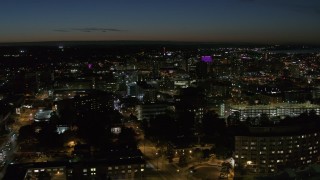 5.7K aerial stock footage a view across Syracuse University at twilight to Downtown Syracuse, New York Aerial Stock Footage | DX0002_215_016