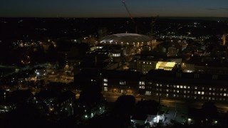 DX0002_215_019 - 5.7K aerial stock footage of orbiting Carrier Dome and Syracuse University at twilight, Syracuse, New York