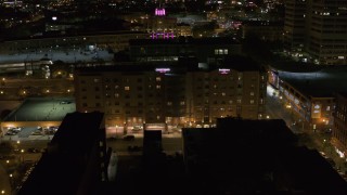 5.7K aerial stock footage of a hotel at night in Downtown Syracuse, New York Aerial Stock Footage | DX0002_215_025