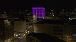 5.7K aerial stock footage orbit Barclay Damon Tower at night, reveal apartment complex in Downtown Syracuse, New York Aerial Stock Footage | DX0002_215_027