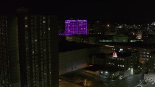 5.7K aerial stock footage orbit Barclay Damon Tower and apartment complex at night, Downtown Syracuse, New York Aerial Stock Footage | DX0002_215_029