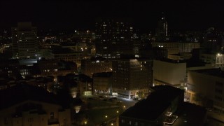 5.7K aerial stock footage orbit One Lincoln Center and reveal apartment building at night, Downtown Syracuse, New York Aerial Stock Footage | DX0002_215_039