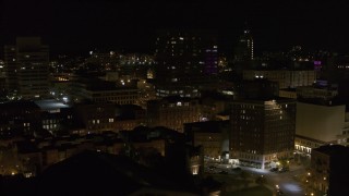 DX0002_215_040 - 5.7K aerial stock footage flyby apartment building at night, reveal One Lincoln Center, Downtown Syracuse, New York