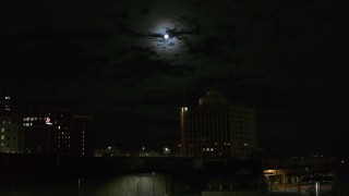 5.7K aerial stock footage of the moon above the 500 Building at night, Downtown Syracuse, New York Aerial Stock Footage | DX0002_215_041