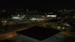 DX0002_215_046 - 5.7K aerial stock footage of flying away from an office building at night, Downtown Syracuse, New York