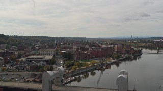 5.7K aerial stock footage wide view of the downtown area of Troy, New York, descend and reveal bridge Aerial Stock Footage | DX0002_216_009