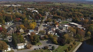 5.7K aerial stock footage of a reverse view of a small town intersection in Fort Edward, New York Aerial Stock Footage | DX0002_216_019