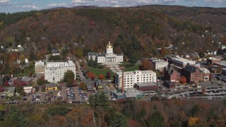 DX0002_218_003 - 5.7K aerial stock footage of a reverse view of the state capitol building and downtown in Montpelier, Vermont