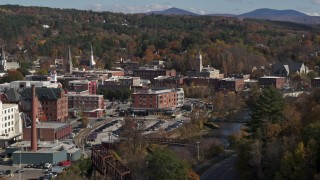 5.7K aerial stock footage of flying by office buildings by the river, Montpelier, Vermont Aerial Stock Footage | DX0002_218_028