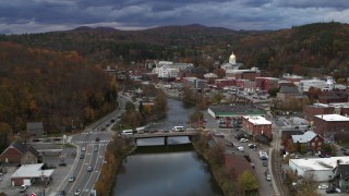 5.7K aerial stock footage follow the Winooski River toward bridge at sunset, Montpelier, Vermont Aerial Stock Footage | DX0002_220_001