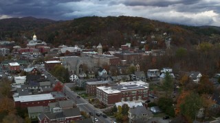 5.7K aerial stock footage of a reverse view and orbit of city hall and brick buildings at sunset, Montpelier, Vermont Aerial Stock Footage | DX0002_220_009