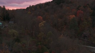 5.7K aerial stock footage of orbiting and flying away from hills with colorful trees at sunset, Montpelier, Vermont Aerial Stock Footage | DX0002_220_043