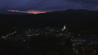 5.7K aerial stock footage of a view of the capitol dome lit up at twilight and downtown buildings, Montpelier, Vermont Aerial Stock Footage | DX0002_220_060