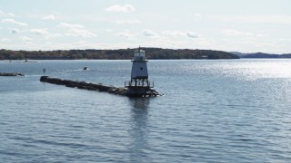 DX0002_222_028 - 5.7K aerial stock footage low altitude orbit around a lighthouse on Lake Champlain, Burlington, Vermont