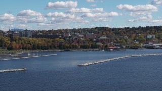 5.7K aerial stock footage of buildings in downtown seen from breakwaters in the lake, Burlington, Vermont Aerial Stock Footage | DX0002_222_043