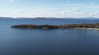 5.7K aerial stock footage of a view of a few waterfront homes on Appletree Point by Lake Champlain, Burlington, Vermont Aerial Stock Footage | DX0002_223_010