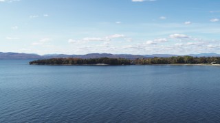 5.7K aerial stock footage of a reverse view of a few waterfront homes on Appletree Point by Lake Champlain, Burlington, Vermont Aerial Stock Footage | DX0002_223_011