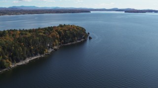 5.7K aerial stock footage of approaching forest on the tip of Lone Rock Point by Lake Champlain, Burlington, Vermont Aerial Stock Footage | DX0002_223_022