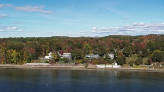 5.7K aerial stock footage of reverse view of four beachfront homes on the shore of Lake Champlain, Burlington, Vermont Aerial Stock Footage | DX0002_223_028