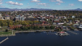 DX0002_224_004 - 5.7K aerial stock footage of orbiting city buildings, park and marina in downtown, Burlington, Vermont