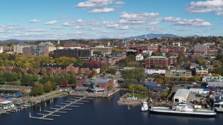 5.7K aerial stock footage of downtown buildings seen while passing a marina, Burlington, Vermont Aerial Stock Footage | DX0002_224_010