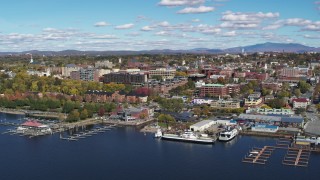 5.7K aerial stock footage reverse view of downtown buildings and marinas, Burlington, Vermont Aerial Stock Footage | DX0002_224_011