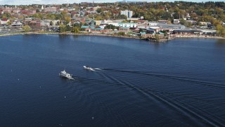 5.7K aerial stock footage of orbiting a speedboat passing a boat on Lake Champlain near Burlington, Vermont Aerial Stock Footage | DX0002_224_028