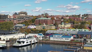 DX0002_224_039 - 5.7K aerial stock footage descend low to orbit office building in downtown, Burlington, Vermont