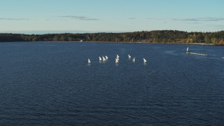 5.7K aerial stock footage flying away from and orbiting a group of sailboats on Lake Champlain, Burlington, Vermont Aerial Stock Footage | DX0002_224_055